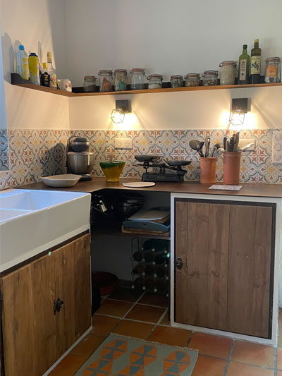 masonry kitchen with rusty metal worktop