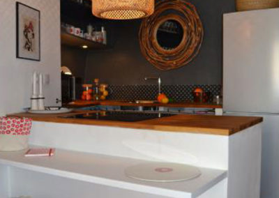 Kitchen open to the living room with grey colour zoning