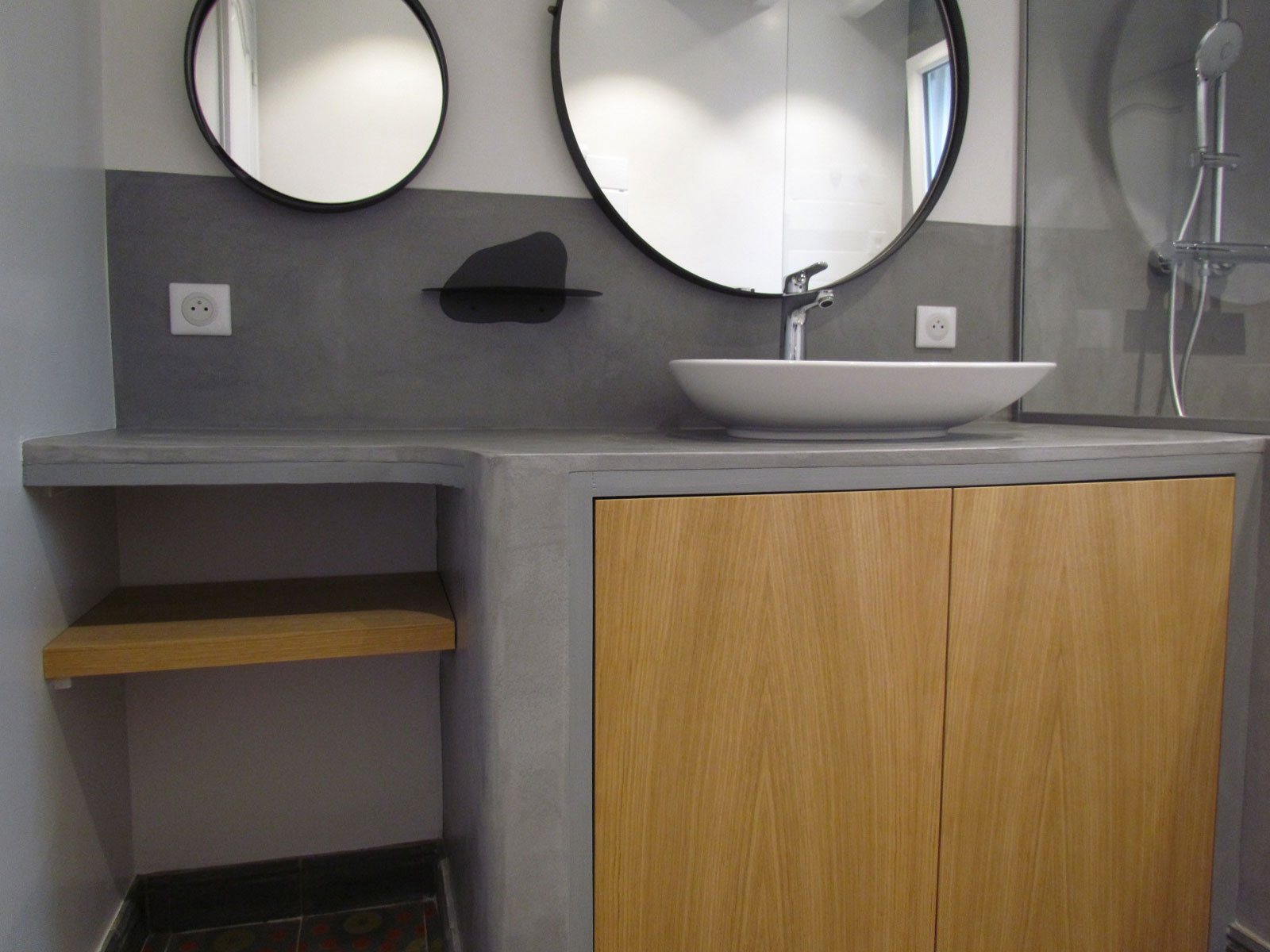 bathroom with a waxed concrete washbasin top with an organic shape